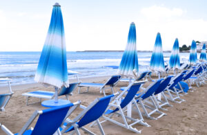 beach with blue hammocks