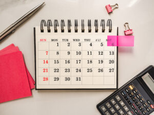 calendar with one pink flag to mark a special date