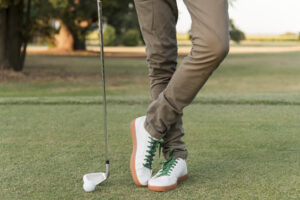 male playing golf